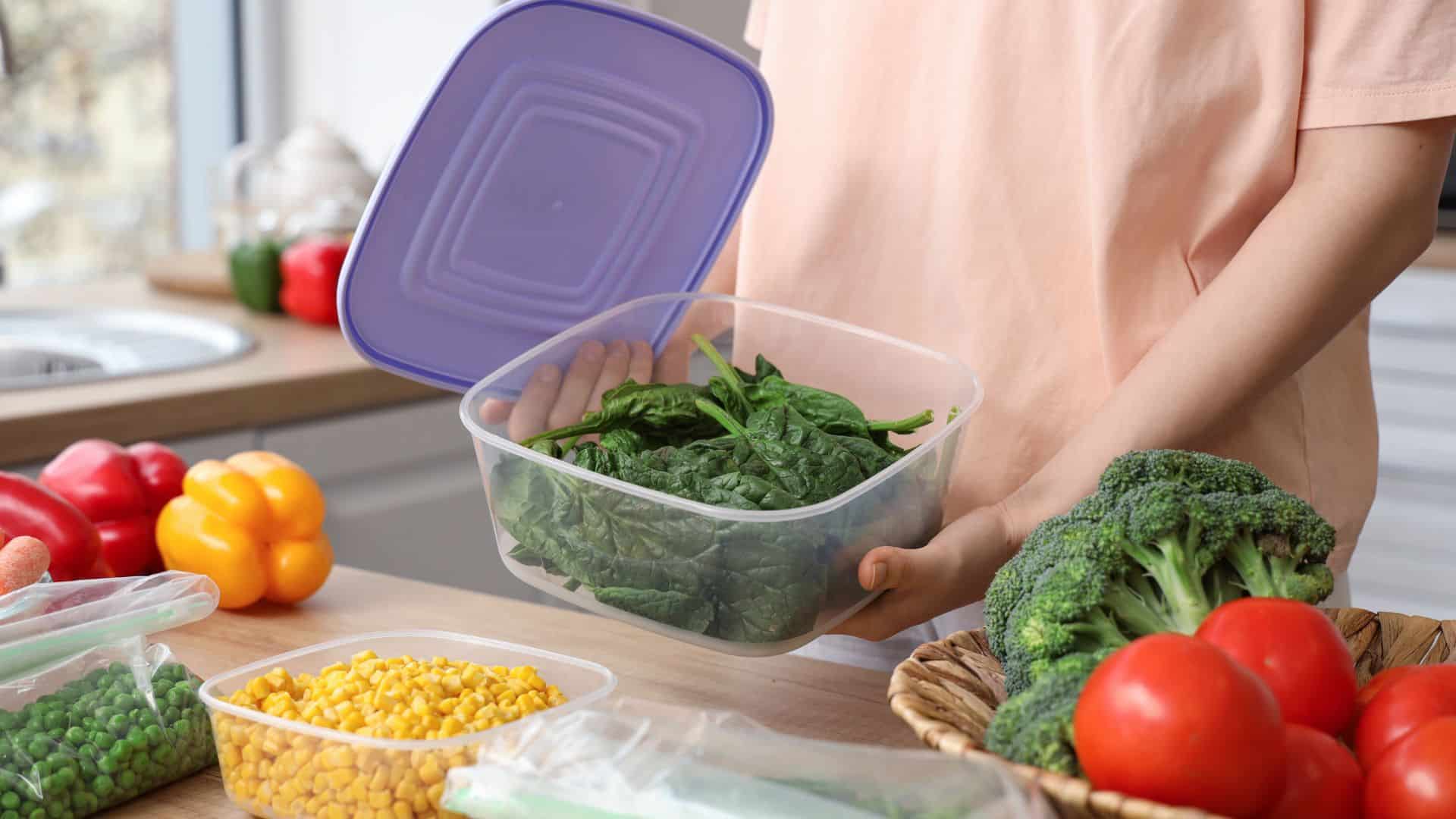 woman holding plastic container