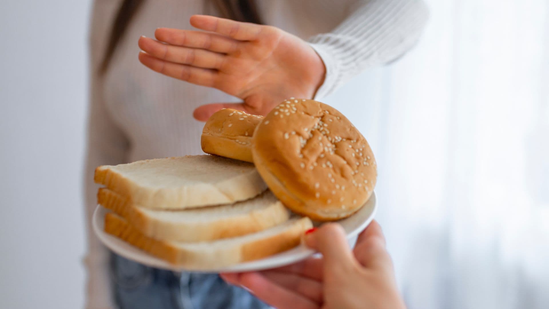woman saying no to bread