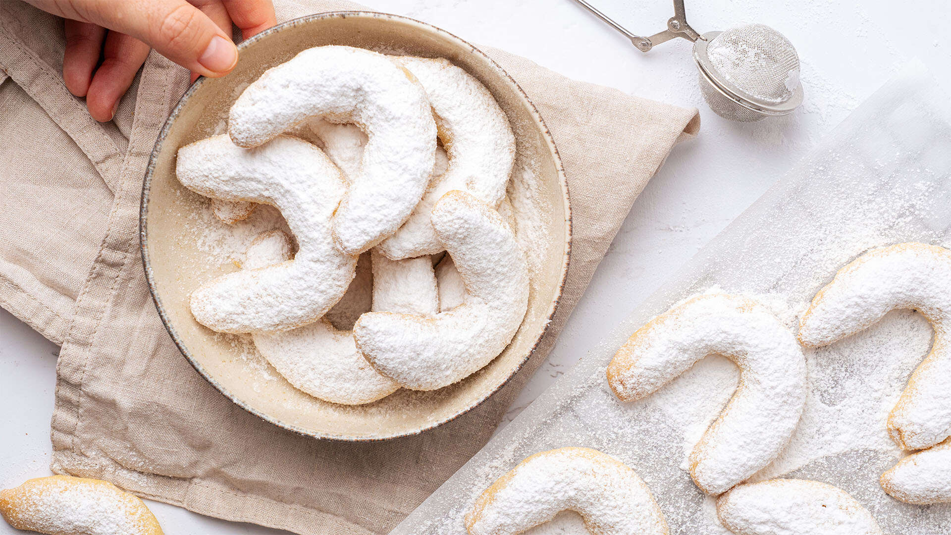Almond Crescent Cookies on a plate.