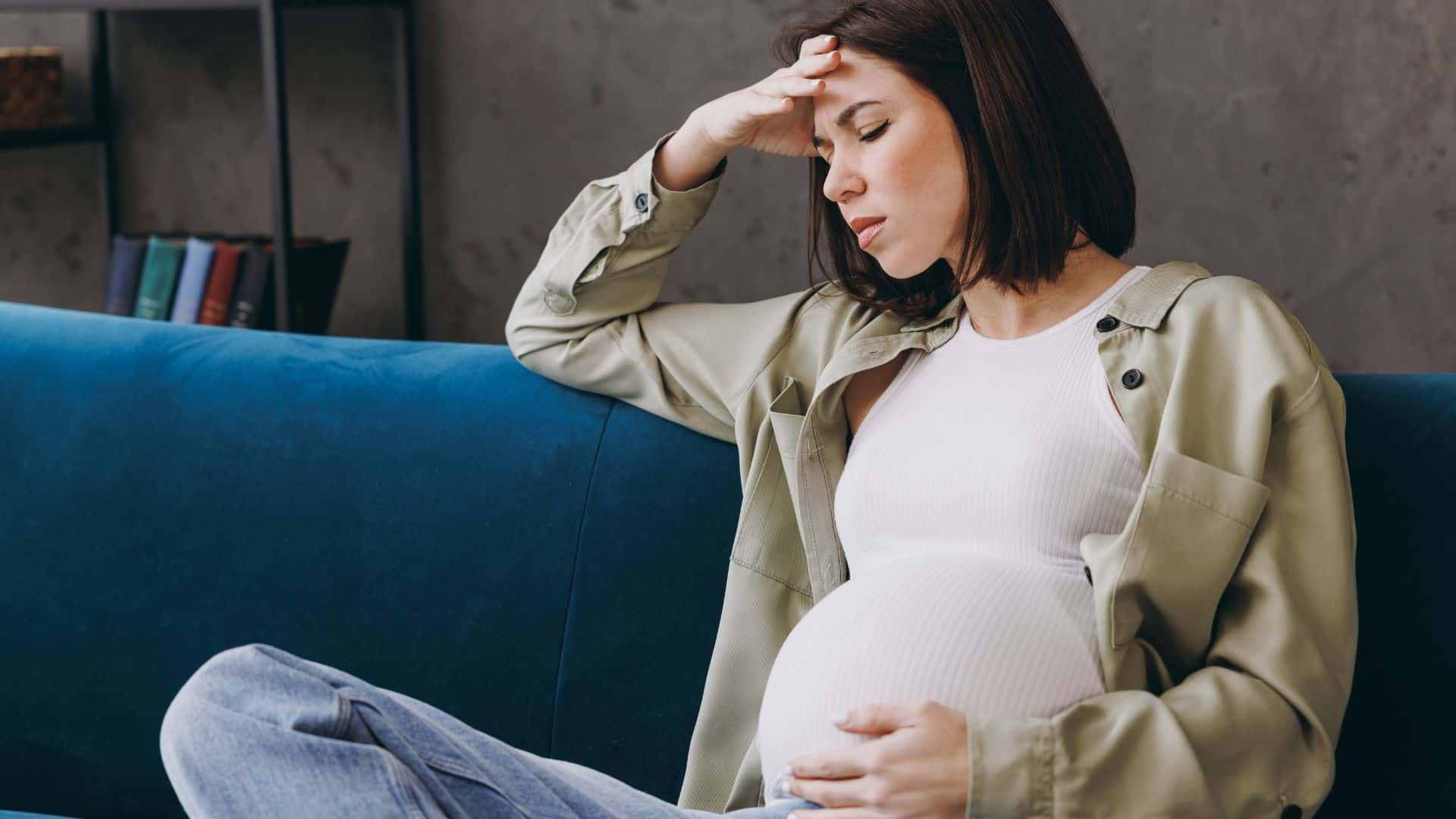 Young upset and tired pregnant woman