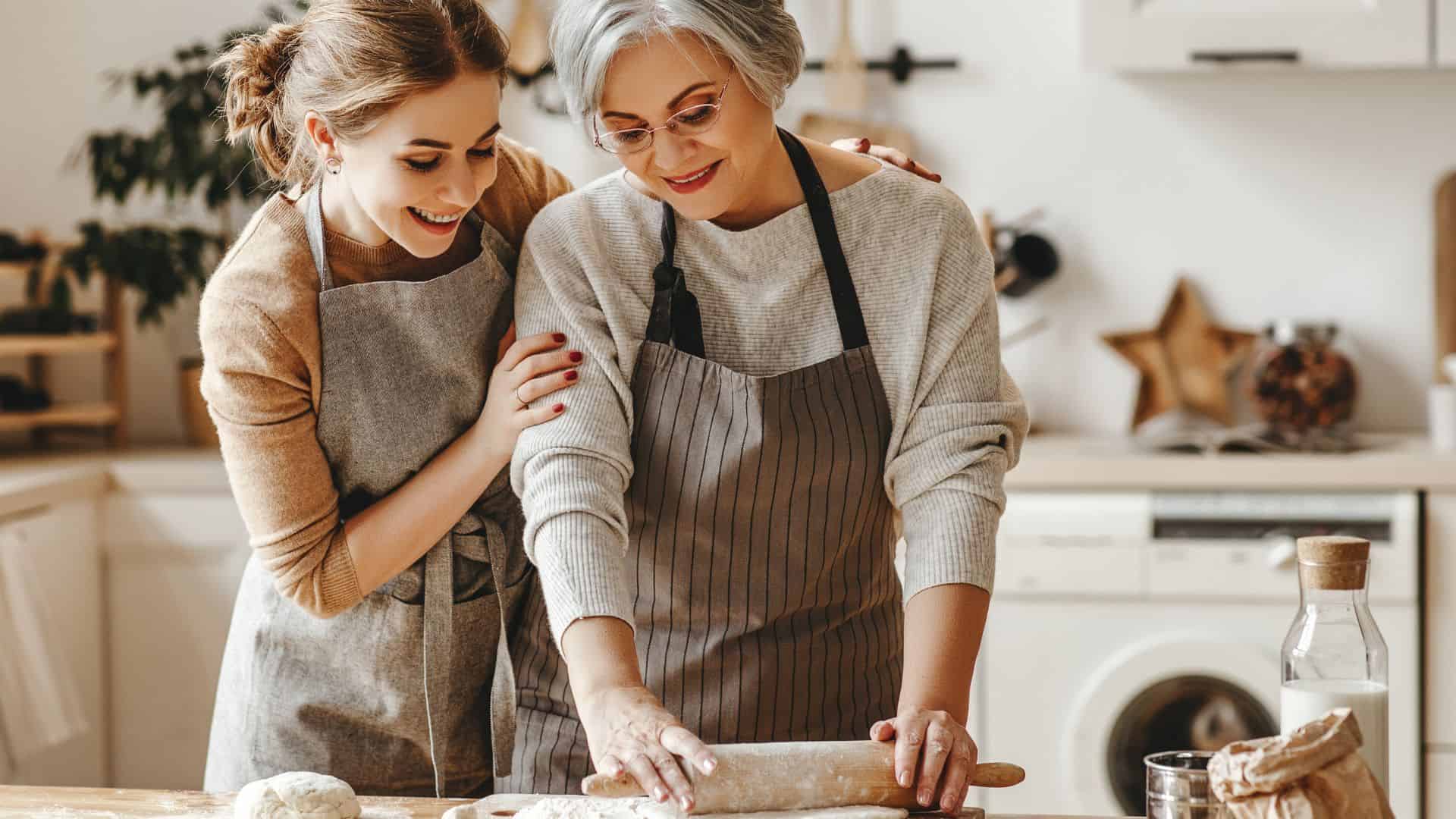 mother-in-law and daughter-in-law daughter cook in kitchen