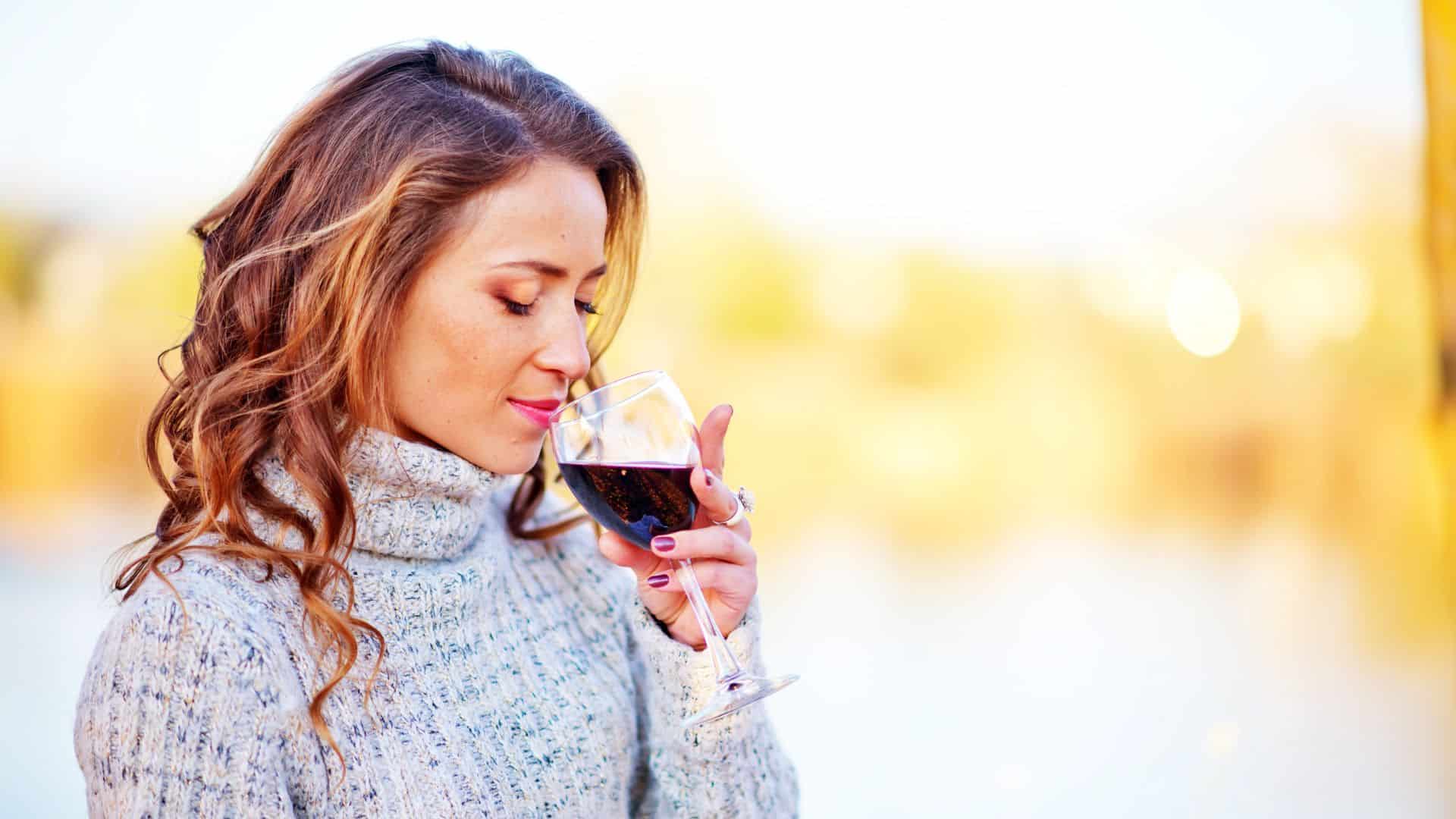woman sipping wine