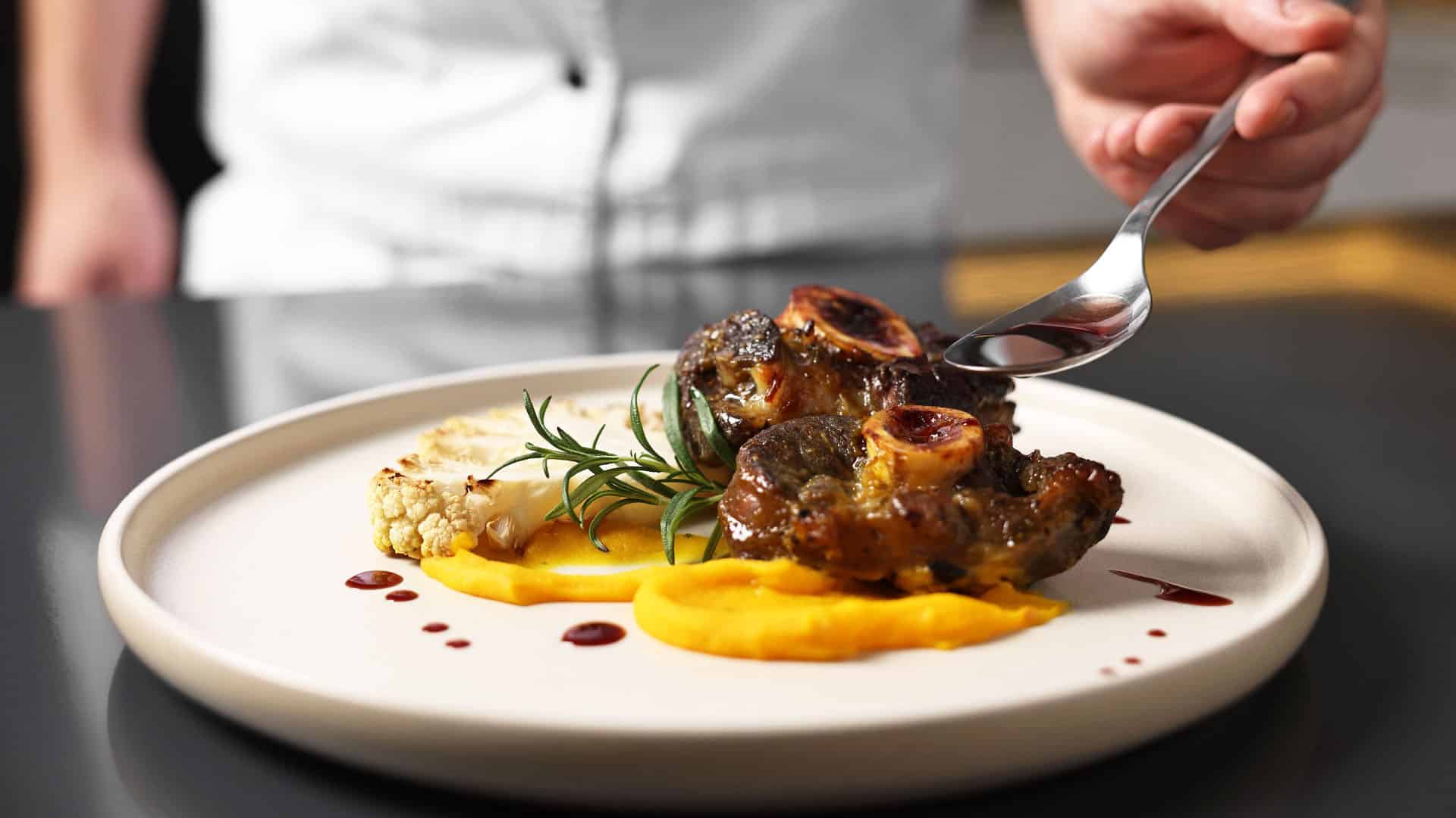 Chef serving food.