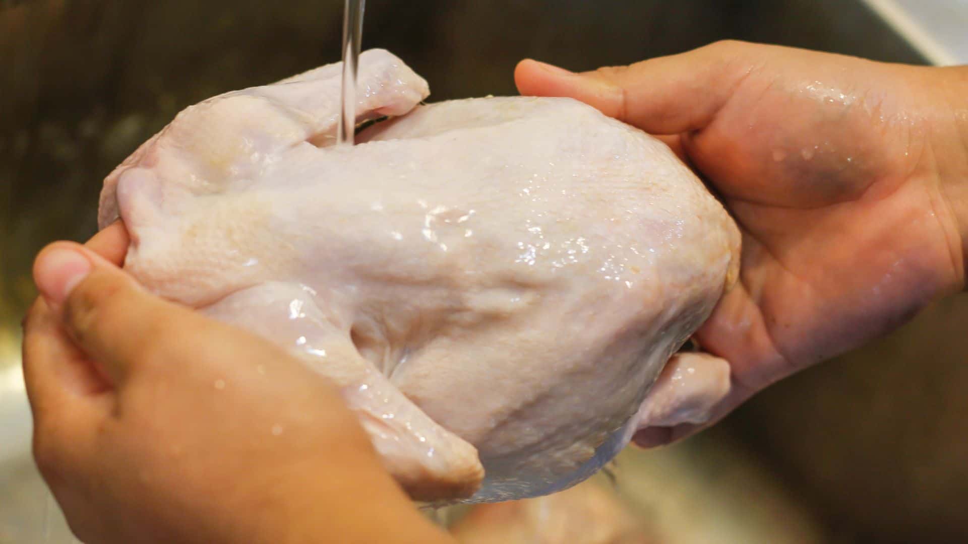Washing raw chicken