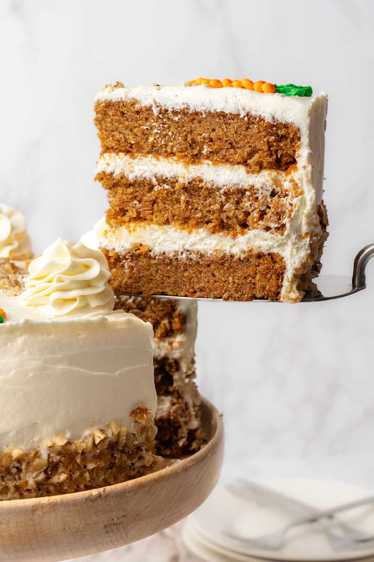 A slice of Carrot Cake on a spoon.