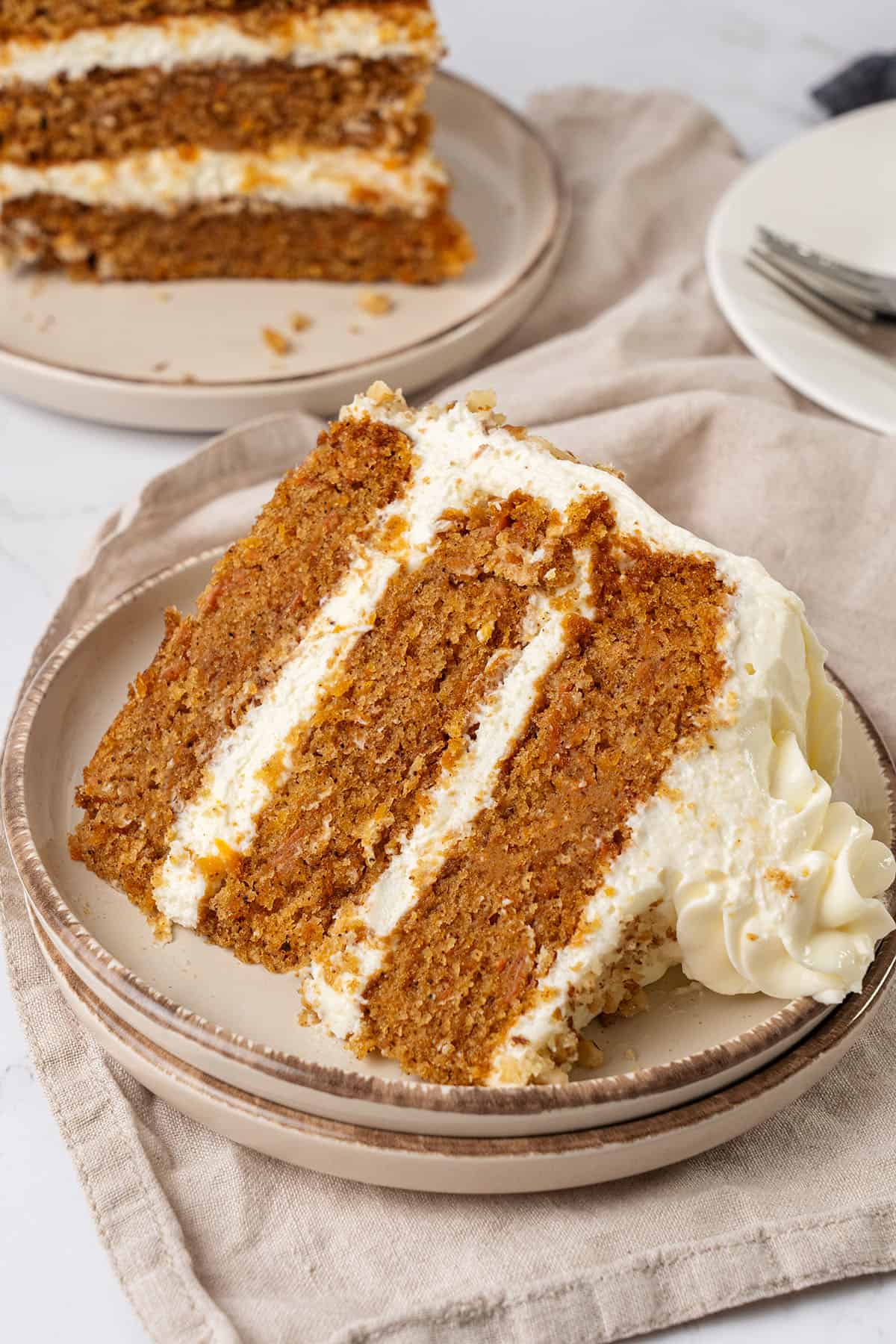 A slice of Carrot Cake on a plate.