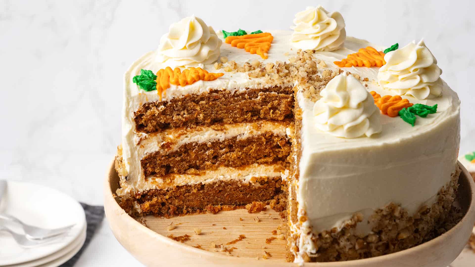 A carrot cake on a cake stand