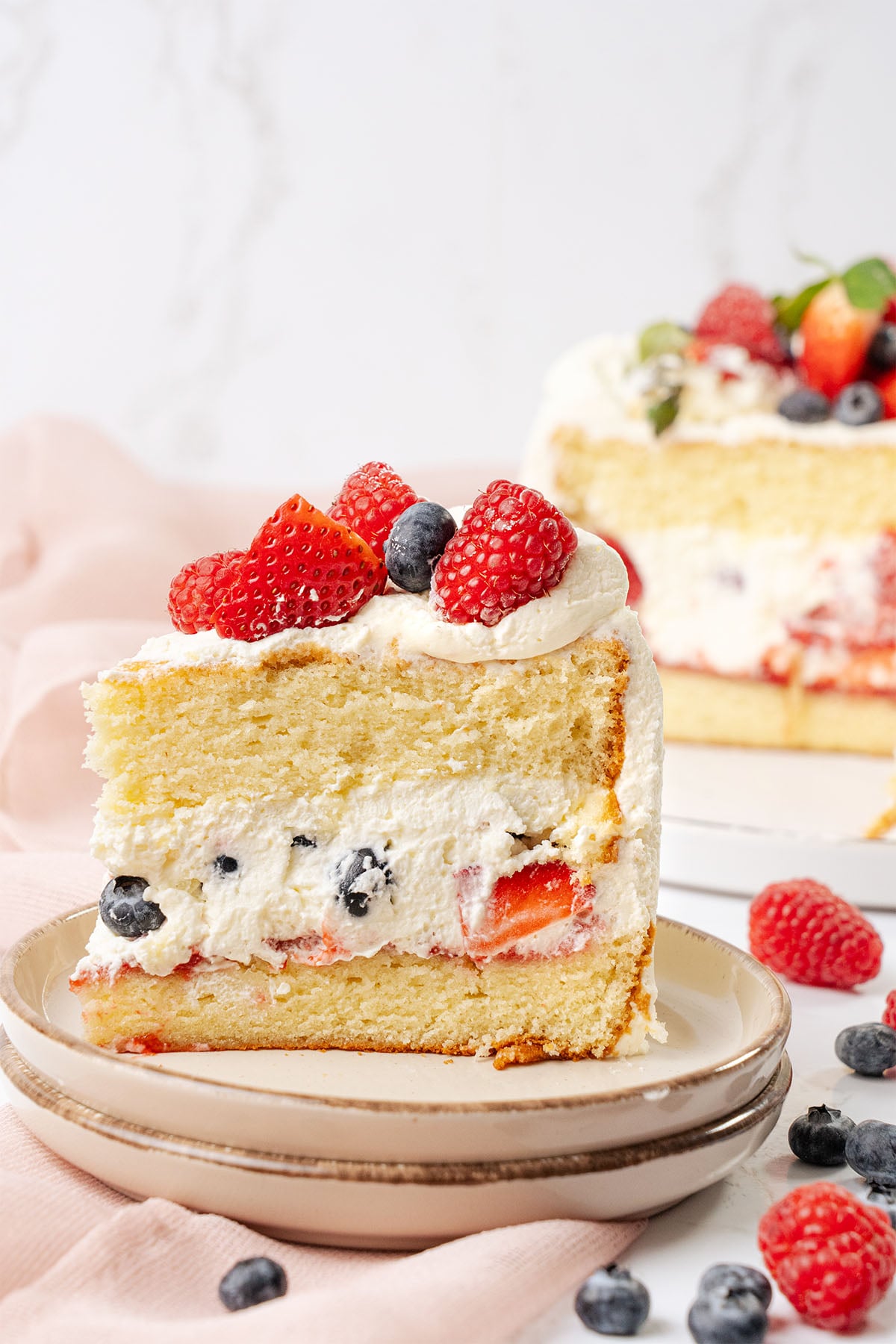 a slice of Berry chantilly cake