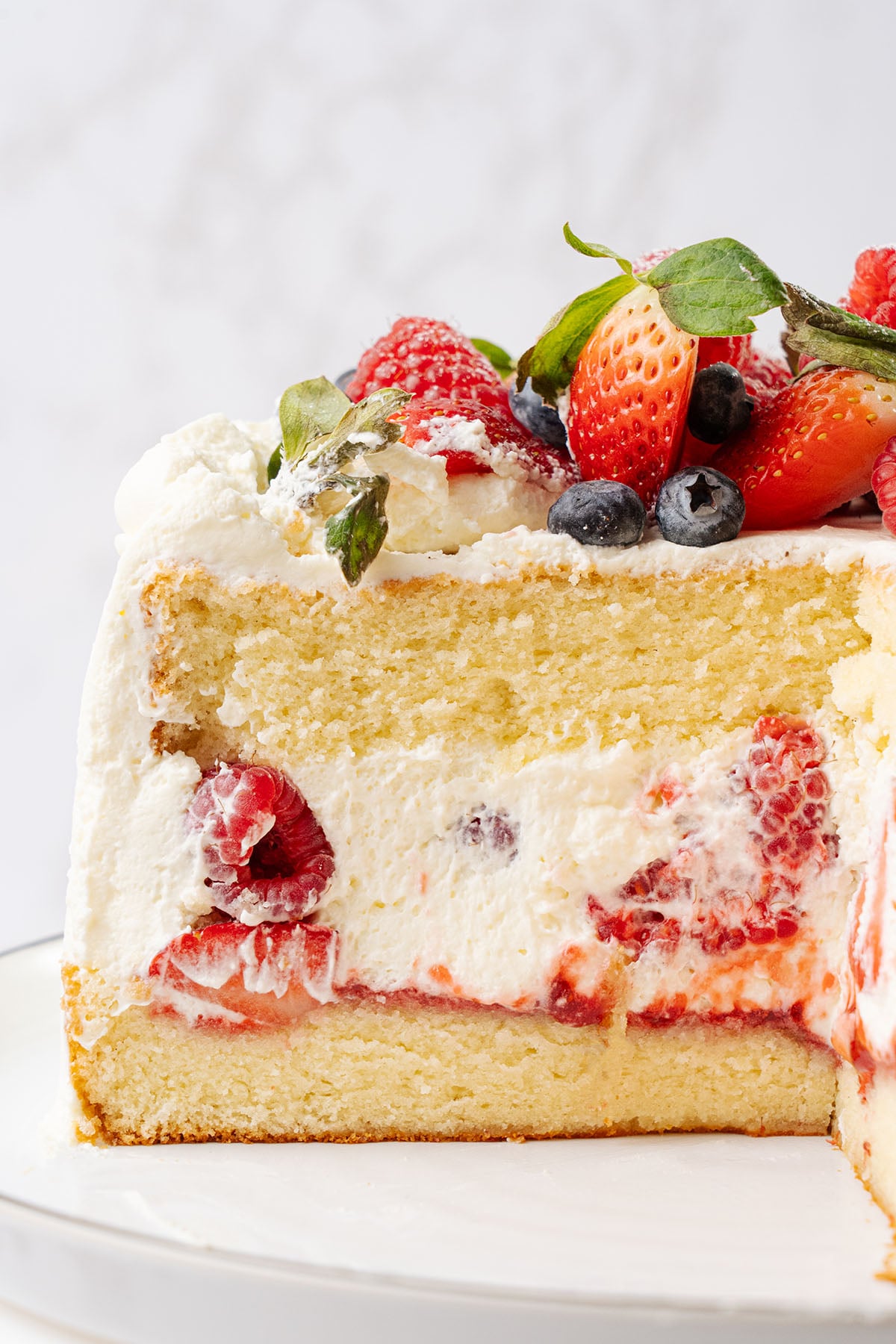 a slice of Berry chantilly cake