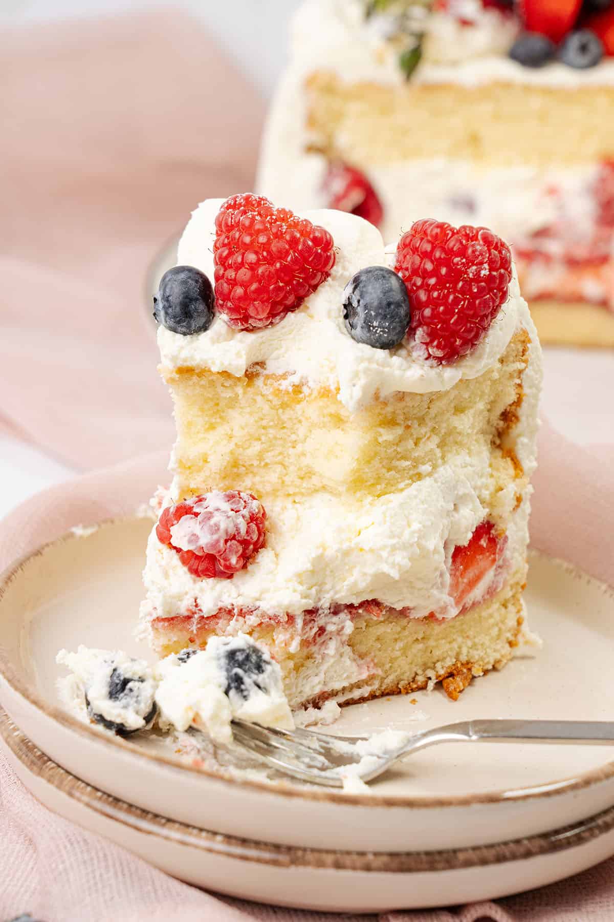 a slice of Berry chantilly cake
