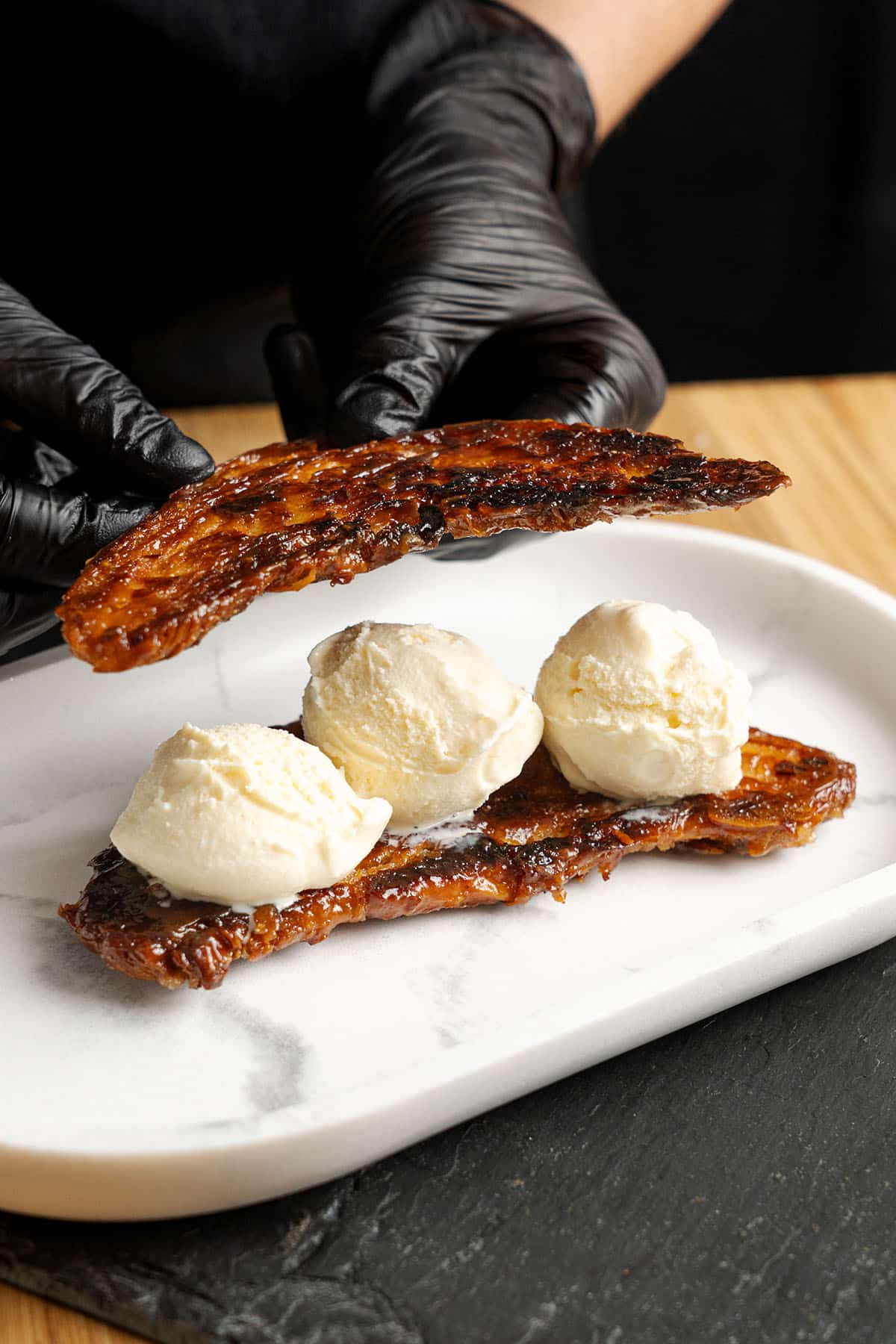 Croissant Ice Cream Sandwich on a plate.