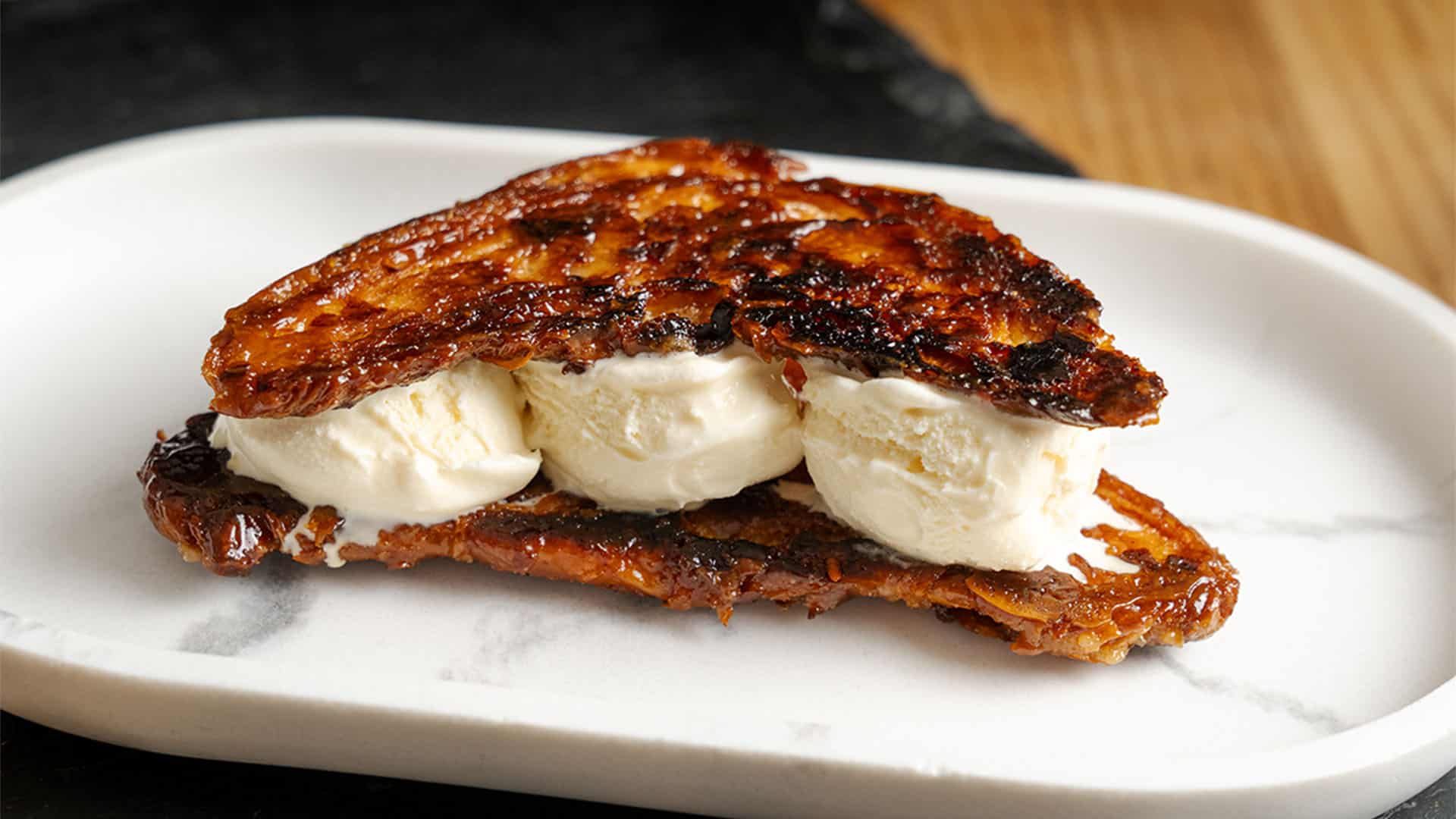 Croissant Ice Cream Sandwich on a plate.