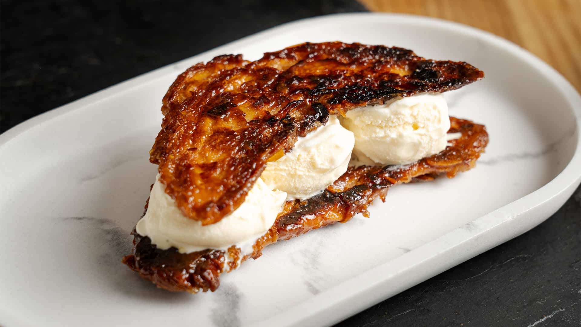 Croissant Ice Cream Sandwich on a plate.