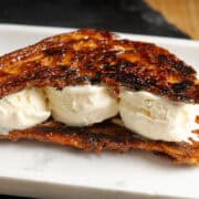 Croissant Ice Cream Sandwich on a plate.