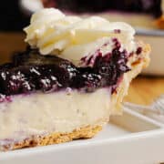 A slice of Blueberry Cream Pie on a plate.