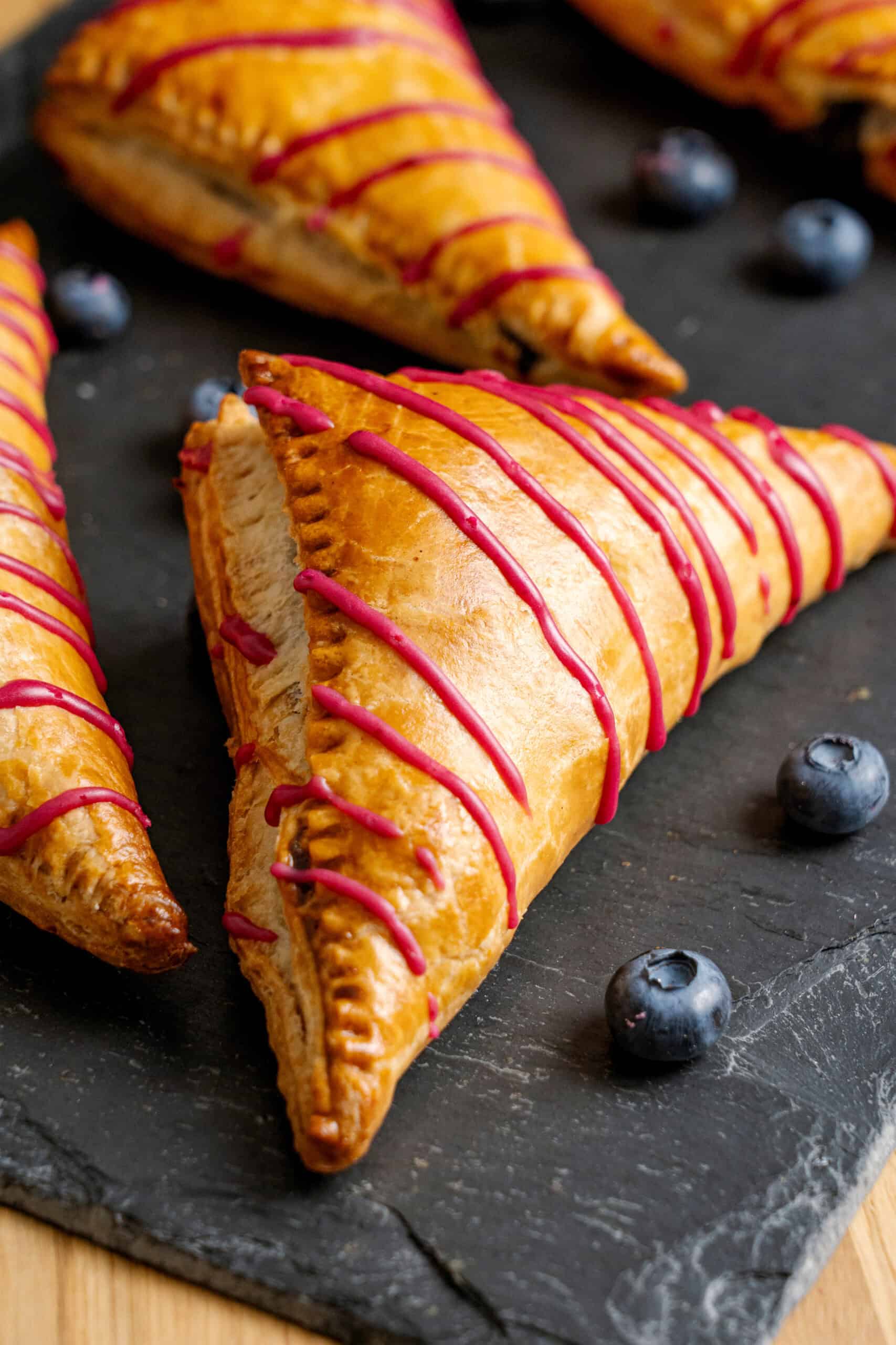 Blueberry turnover on a cutting board.