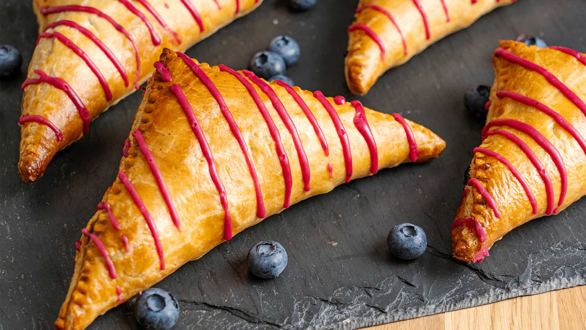 Blueberry turnover on a cutting board.