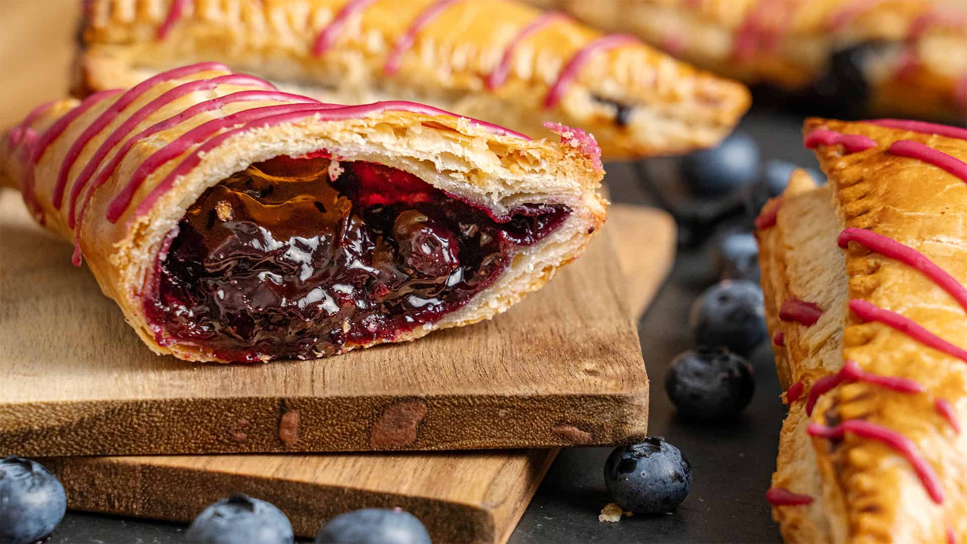 A blueberry turnover cut in half.