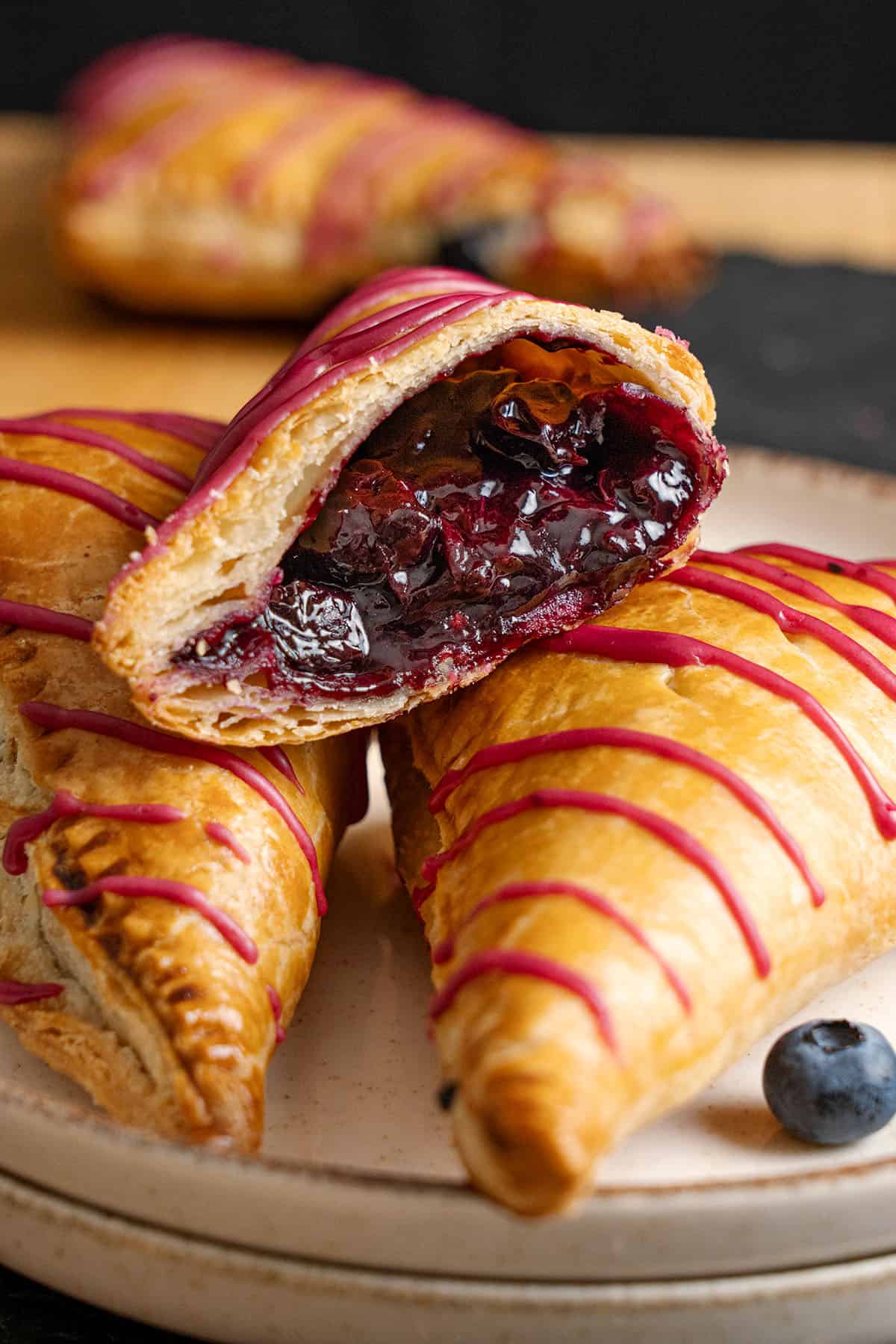A blueberry turnover cut in half.