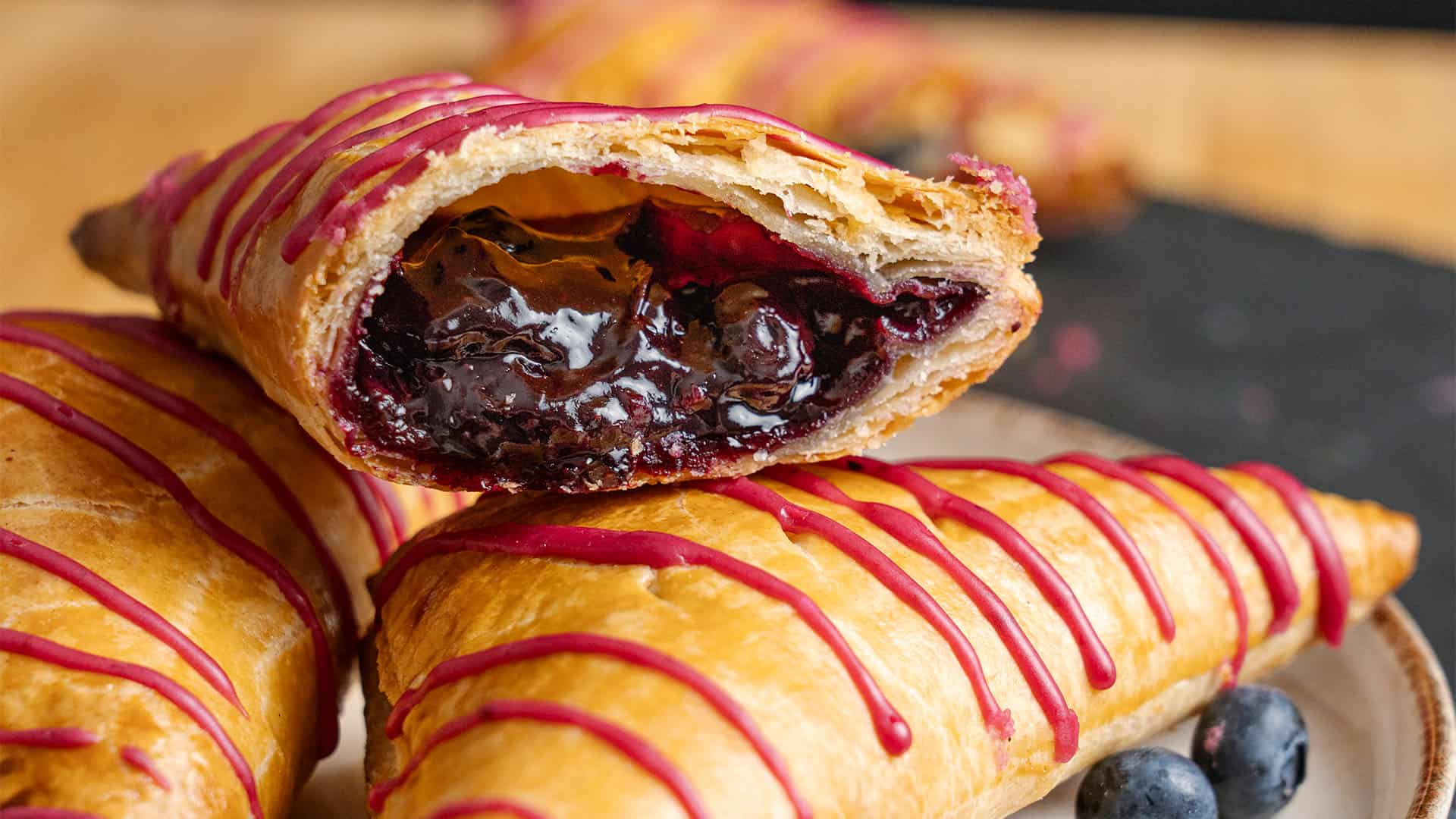 A blueberry turnover cut in half.