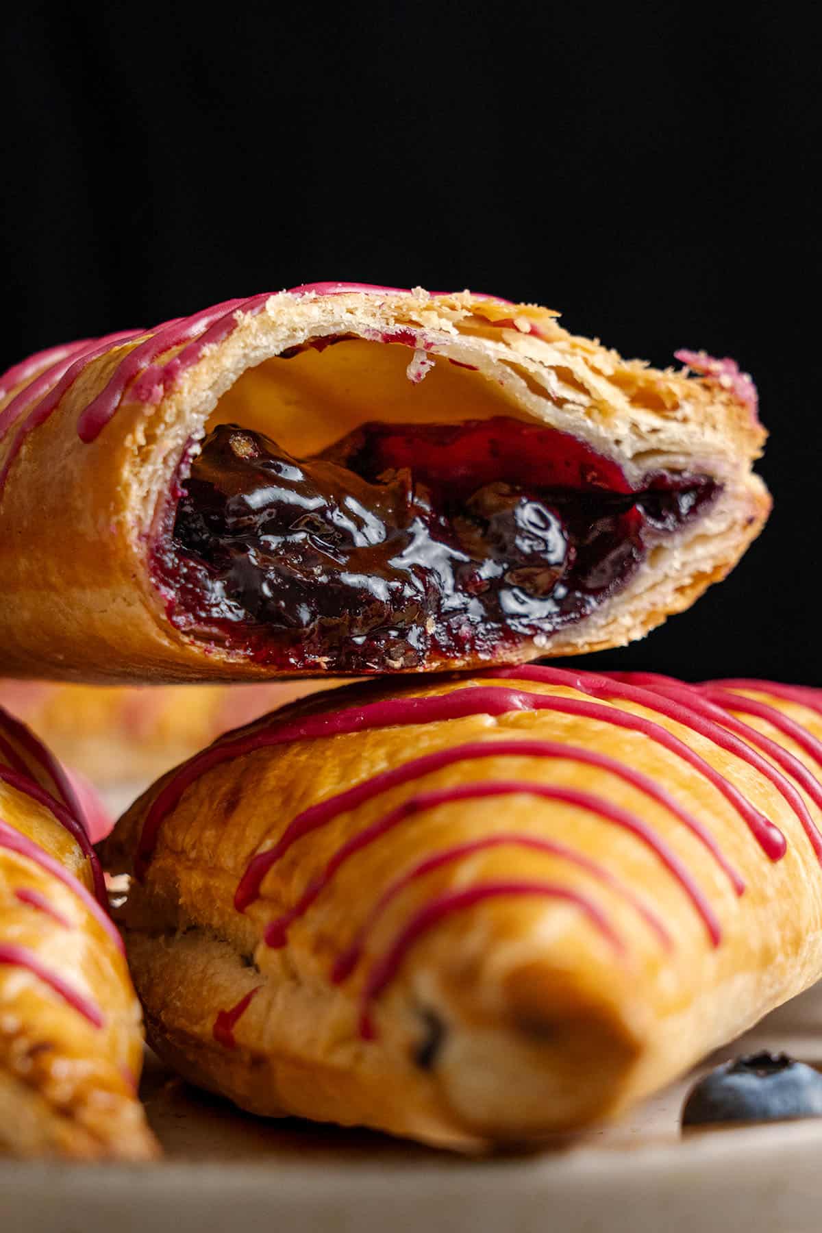 A blueberry turnover cut in half.
