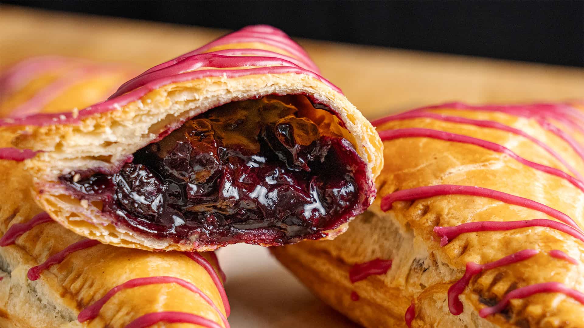 A blueberry turnover cut in half.