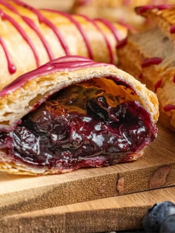 A blueberry turnover cut in half.