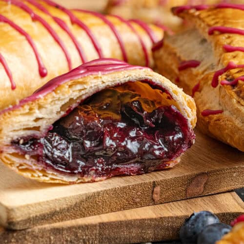 A blueberry turnover cut in half.