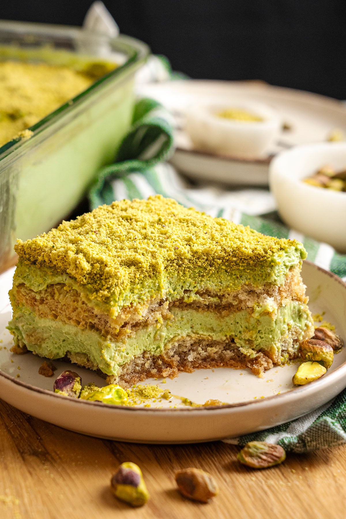 A slice of Pistachio tiramisu on a plate.
