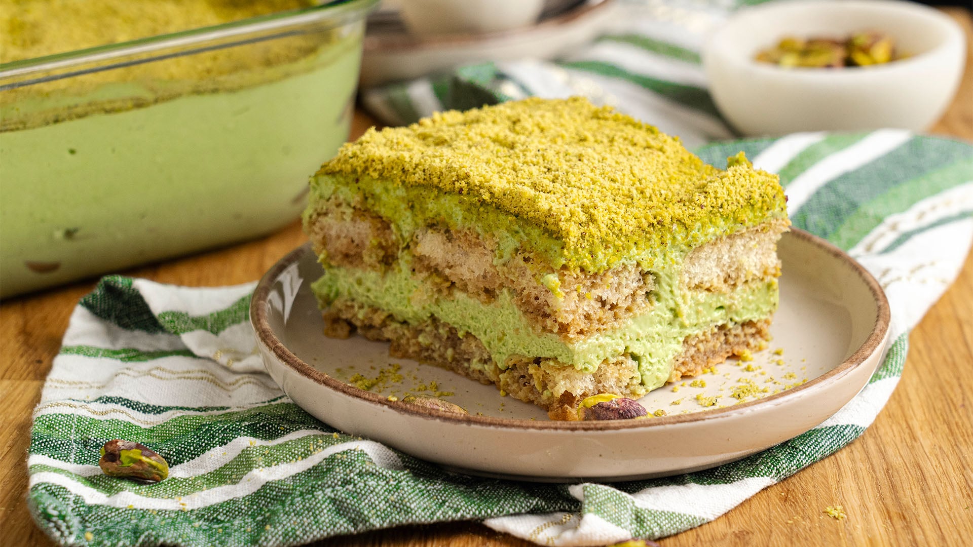 A slice of Pistachio tiramisu on a plate.