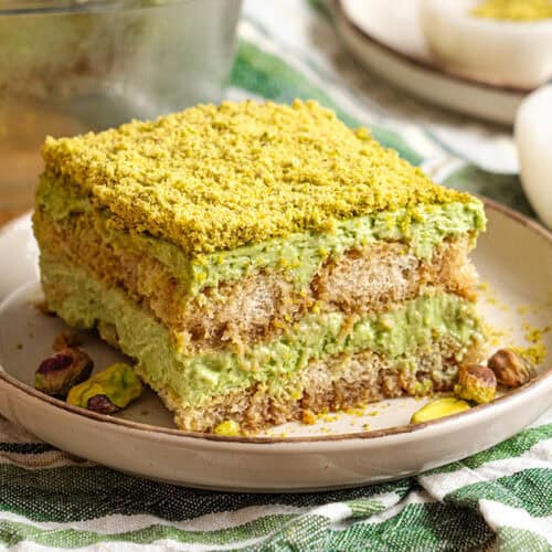 A slice of Pistachio tiramisu on a plate.