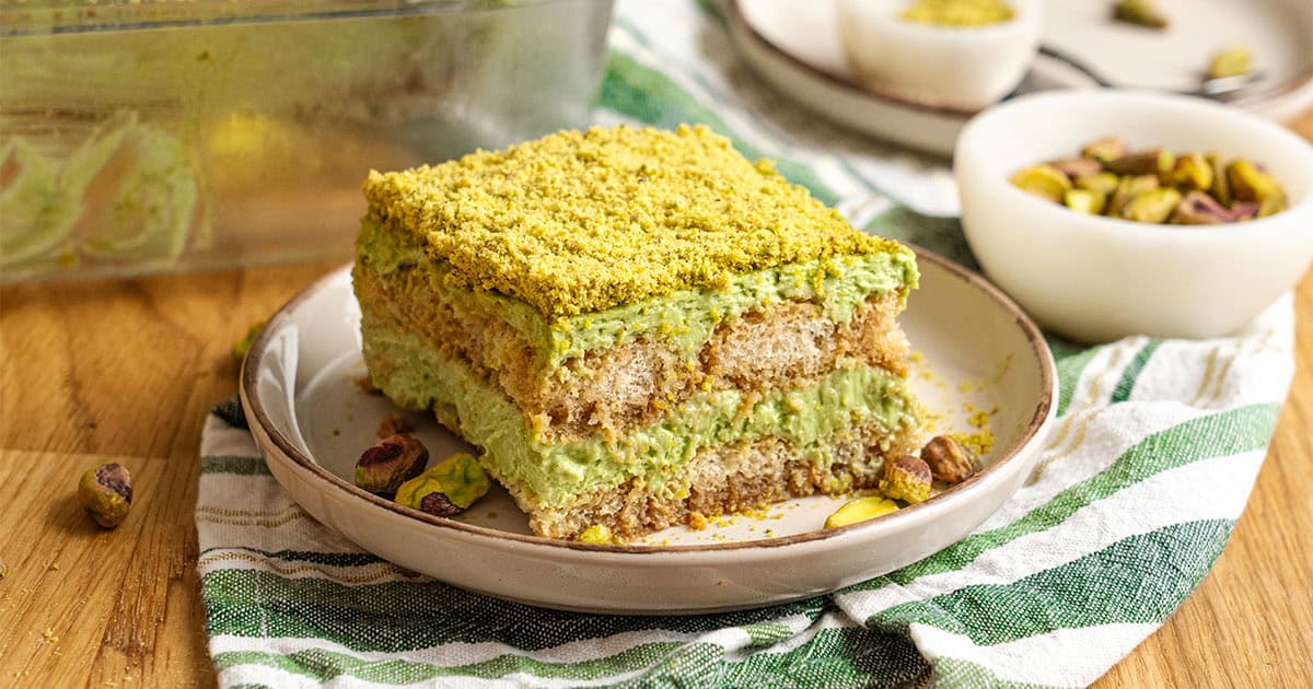 A slice of Pistachio tiramisu on a plate.