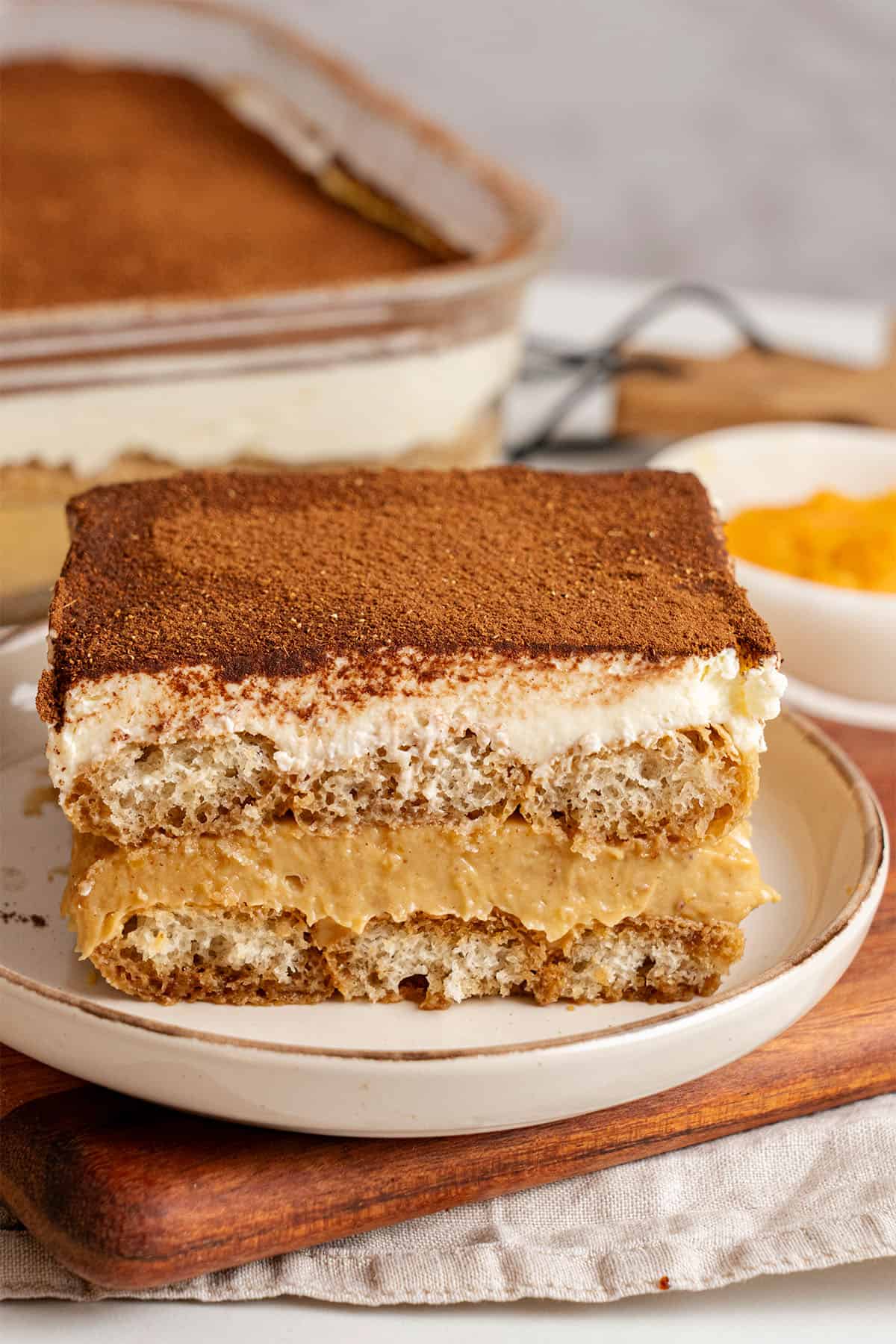 A slice of Pumpkin Tiramisu on a plate.